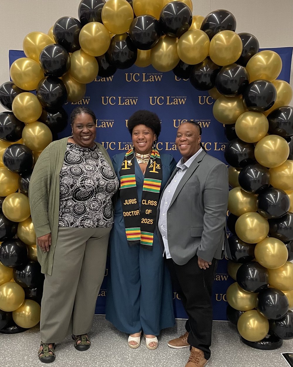Dana Johnson, at right, celebrating with family at a UC Law San Francisco graduation.